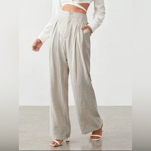 Tan fabric trousers baggy legged with tags, never worn